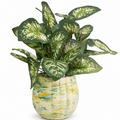 Handcrafted concrete planter with green marbled design, filled with realistic silk greenery arrangement, displayed on a white background.